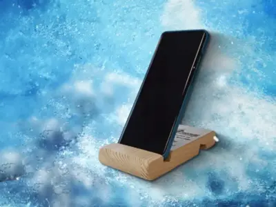 Скрийншот от видео за дървени стойки за телефони с телефон - Професионална уеб разработка за бизнес нужди и дигитални проекти - УебКома ООД